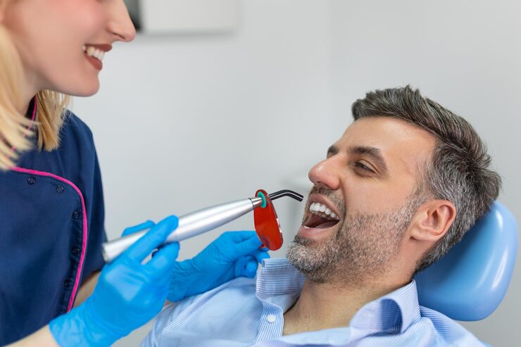 dentist treating patient’s teeth